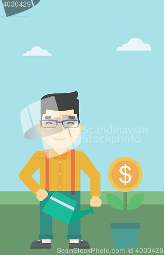 Image of Businessman watering money flower.