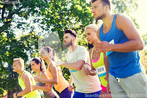 Image of sportsmen with badge numbers on start of race