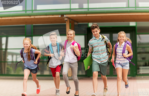 Image of group of happy elementary school students running