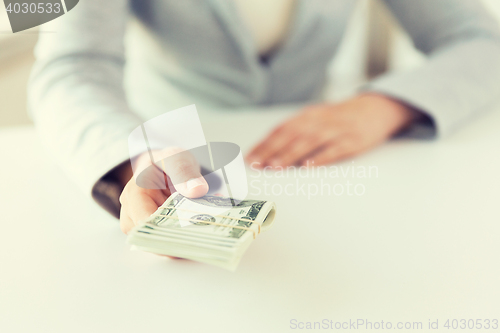 Image of close up of woman hands holding us dollar money