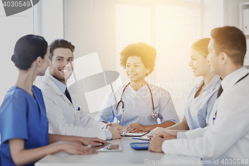 Image of group of happy doctors meeting at hospital office