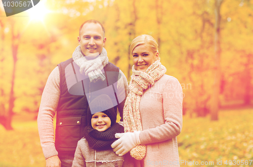 Image of happy family in autumn park