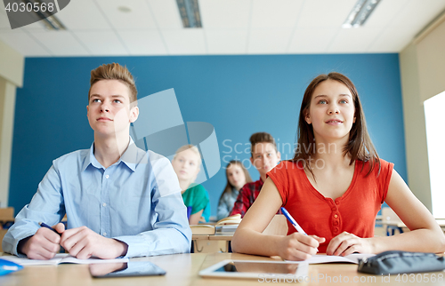 Image of students with notebooks and tablet pc at school