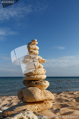 Image of stone piles on the beach