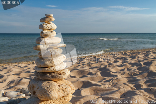 Image of stone piles on the beach