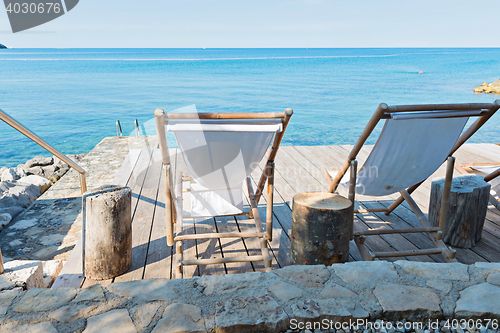 Image of Wooden floor with chaise-longues in Istria