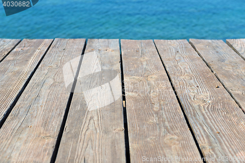 Image of Empty top of wooden background and view to the sea