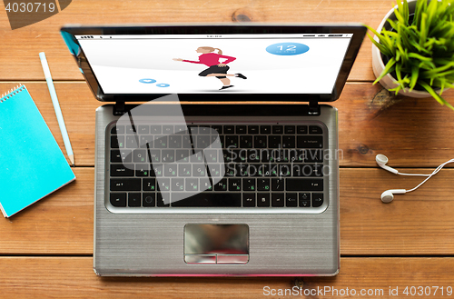 Image of close up of laptop computer with fitness app