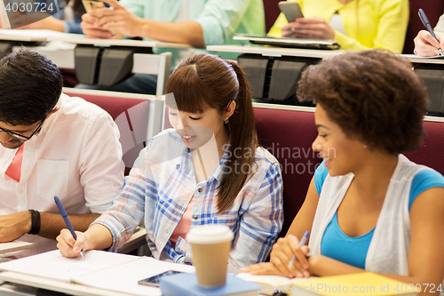 Image of group of international students talking on lecture