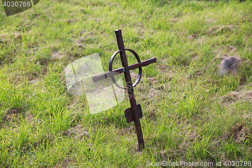 Image of old rusty grave cross on cemetery in ireland