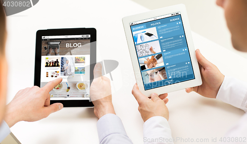 Image of close up of businessman hands with tablet pc