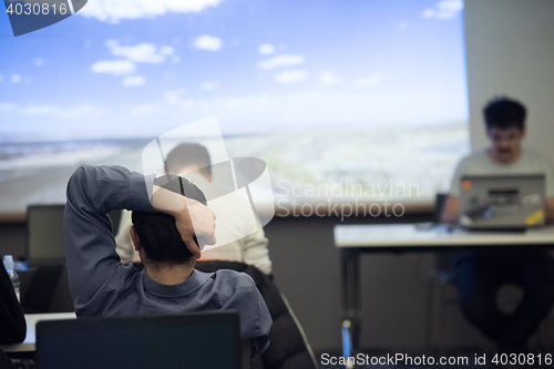 Image of young man dreaming clouds on presentation