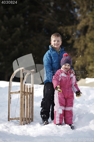 Image of Brother and sister portrait in winter time