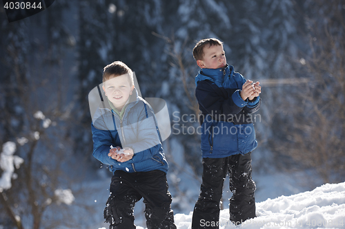 Image of kids playing with  fresh snow