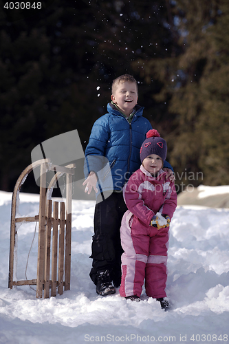 Image of Brother and sister portrait in winter time