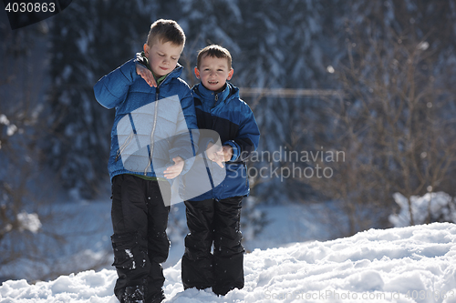 Image of kids playing with  fresh snow