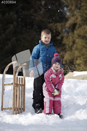 Image of Brother and sister portrait in winter time