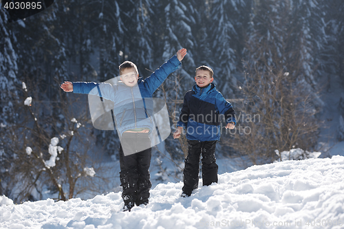 Image of kids playing with  fresh snow