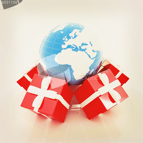 Image of Traditional Christmas gifts and earth. Global holiday concept . 