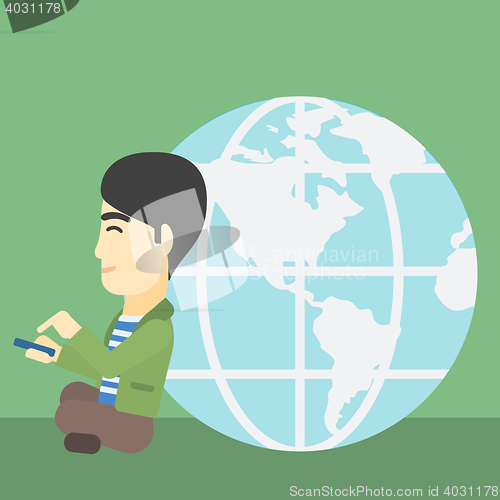 Image of Businessman sitting near Earth globe.