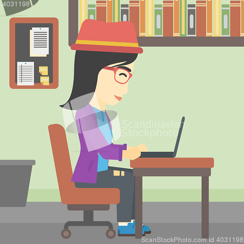 Image of Business woman working on her laptop.