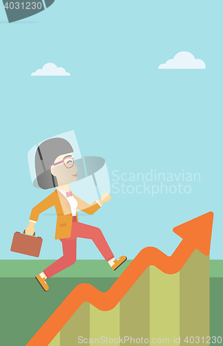 Image of Business woman running along the growth graph.