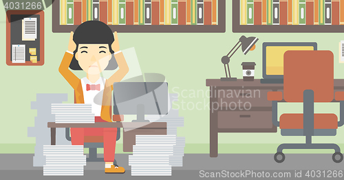 Image of Business woman in despair sitting in office.