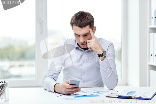 Image of close up of businessman with smartphone