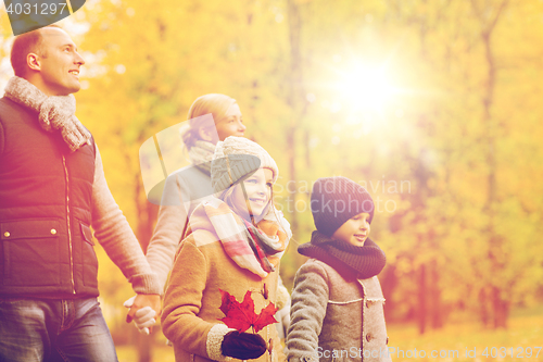 Image of happy family in autumn park