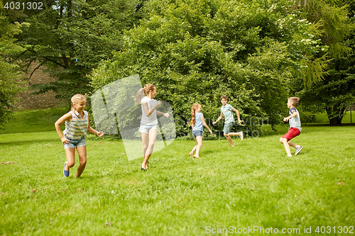 Image of happy kids running and playing game outdoors