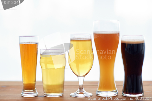 Image of close up of different beers in glasses on table