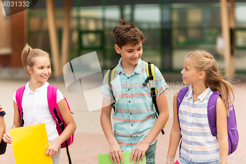 Image of group of happy elementary school students walking