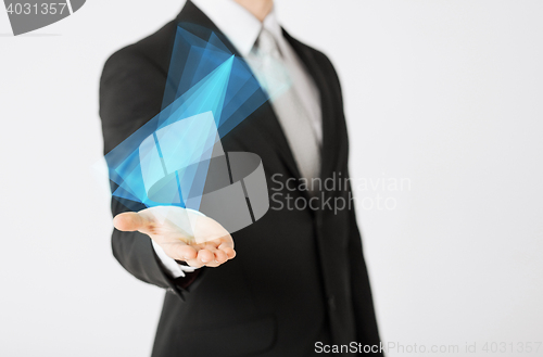 Image of close up of businessman showing virtual hologram