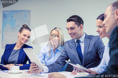 Image of business team with tablet pc having discussion