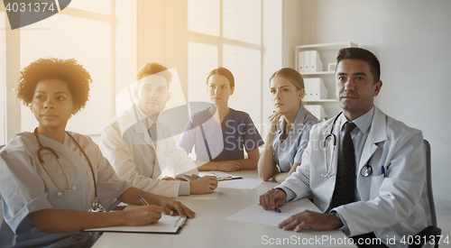 Image of group of happy doctors meeting at hospital office