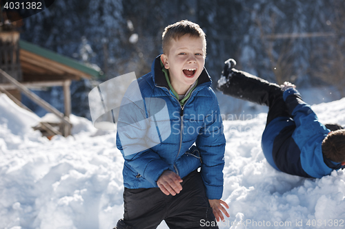 Image of kids playing with  fresh snow