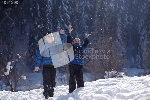 Image of kids playing with  fresh snow