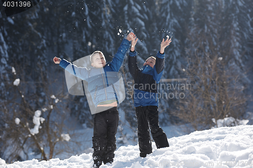 Image of kids playing with  fresh snow
