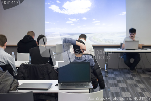 Image of young man dreaming clouds on presentation