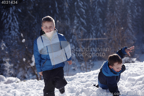 Image of kids playing with  fresh snow