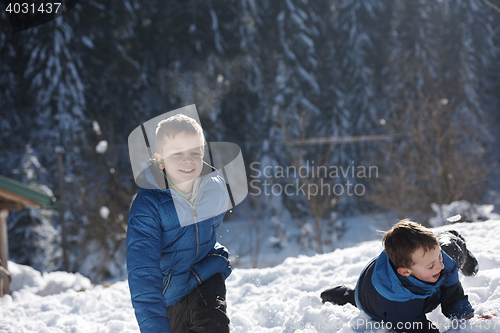 Image of kids playing with  fresh snow