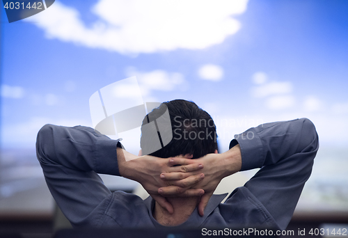 Image of young man dreaming clouds on presentation