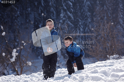 Image of kids playing with  fresh snow