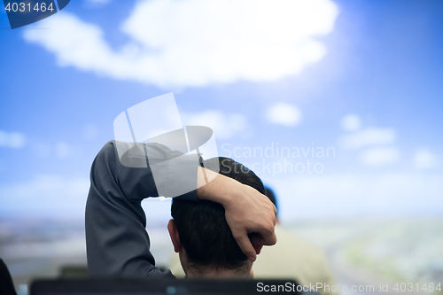 Image of young man dreaming clouds on presentation