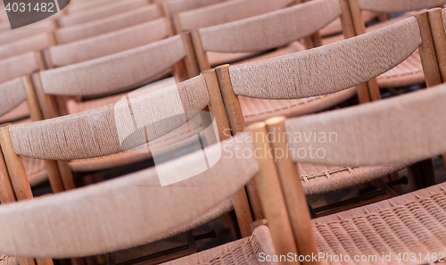 Image of Rows of seats inside church, selective focus