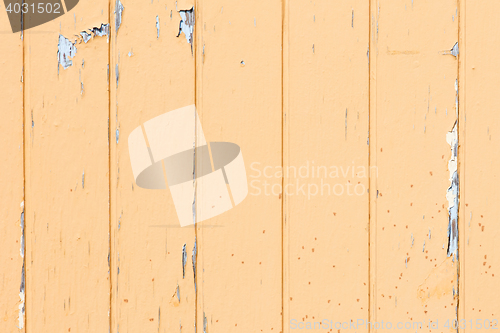 Image of Old wooden wall with yellow paint