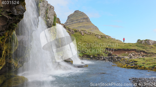 Image of Kirkjufellsfoss waterfall near the Kirkjufell mountain, unrecogn
