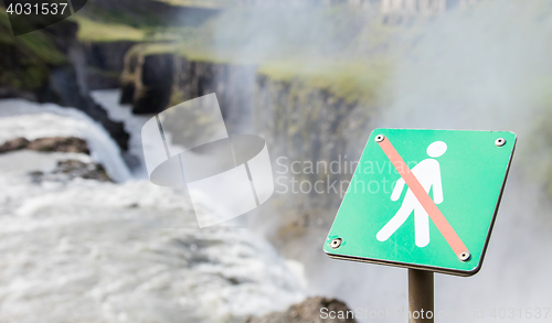 Image of Forbidden to walk over here - Iceland - Fierce waterfall in back