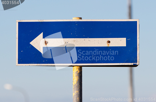 Image of Traffic sign arrow pointing left, sign on an abandoned Amarican 