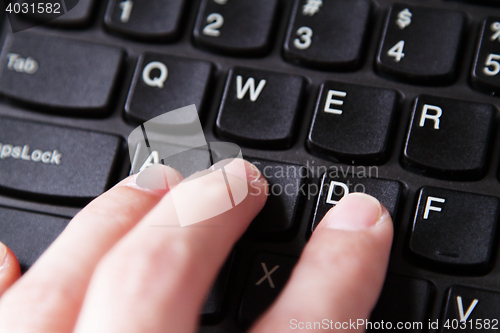 Image of Fingers on keyboard
